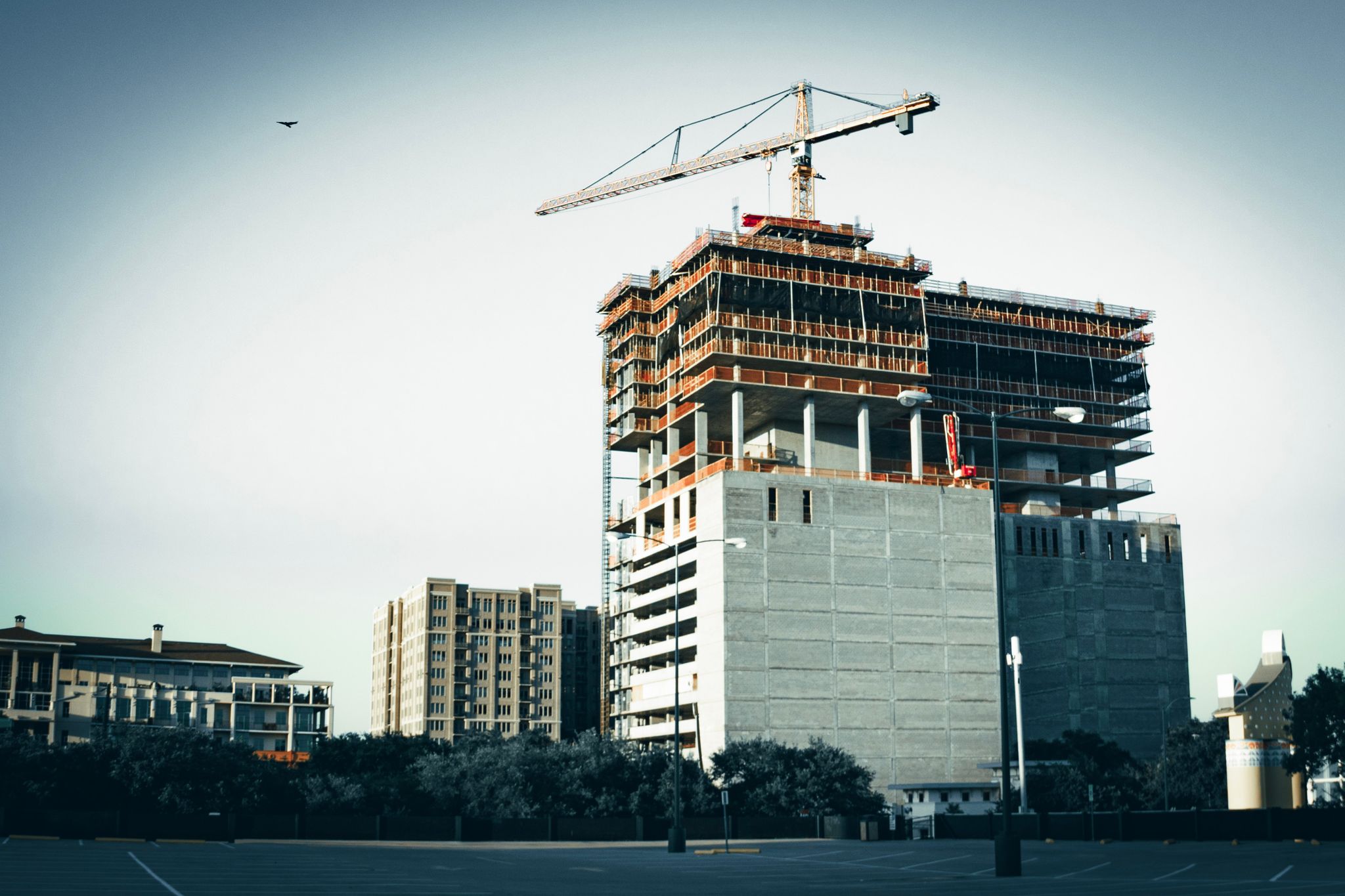 A modern high-rise building under construction in urban Houston, Texas.
